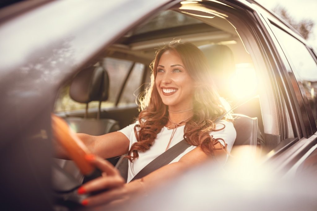 Woman smiling while driving