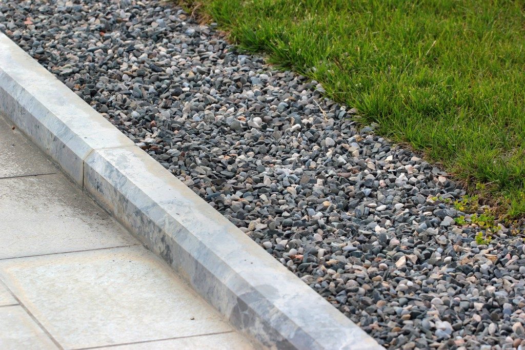 Border kerb between lawn and sidewalk in a park