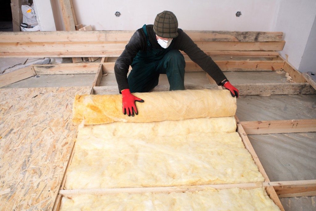 worker installing insulation