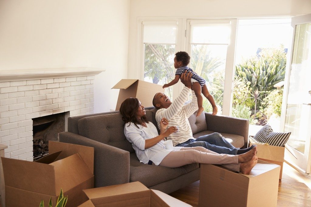 couple playing with their baby