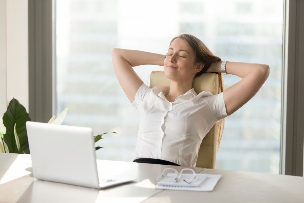 businesswoman relaxing in her office