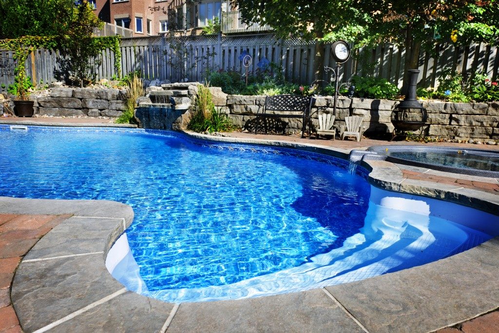 Fiberglass swimming pool in the backyard