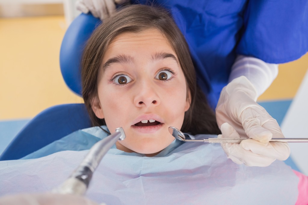 Scared young dental patient