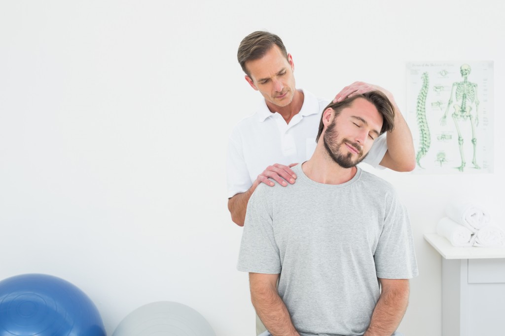 Men getting chiropractic treatment