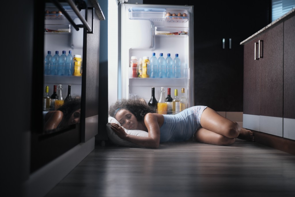 sleeping by the fridge