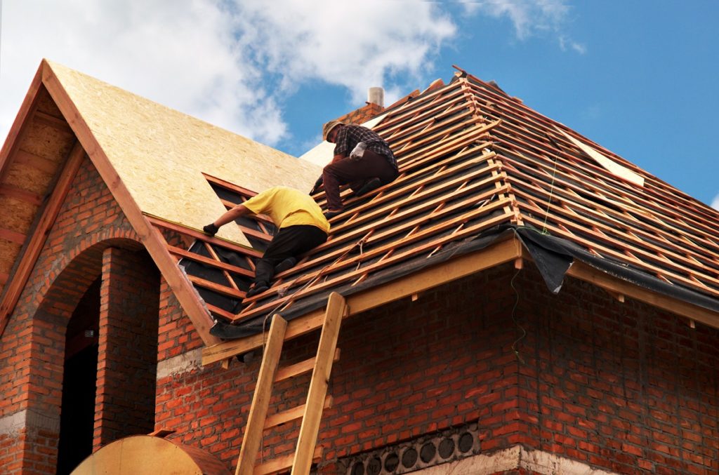 men fixing the roof