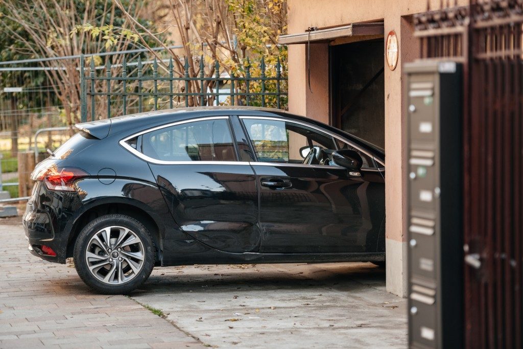 Car entering through garage door