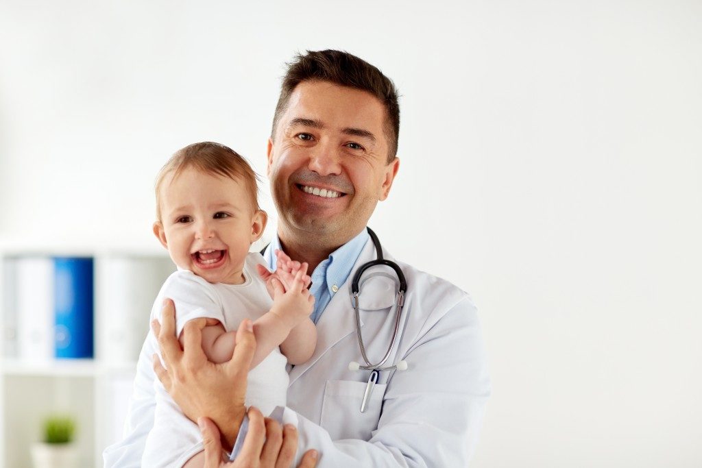 pediatrician with baby