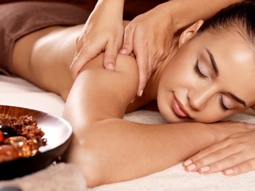 woman getting a massage at the spa