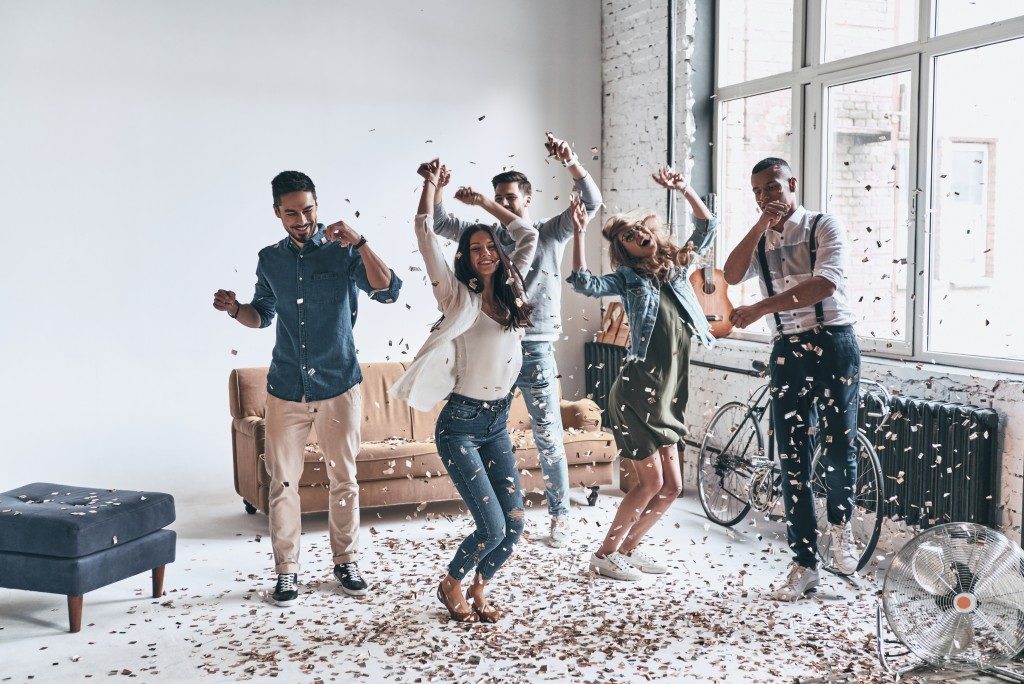 people dancing in an apartment