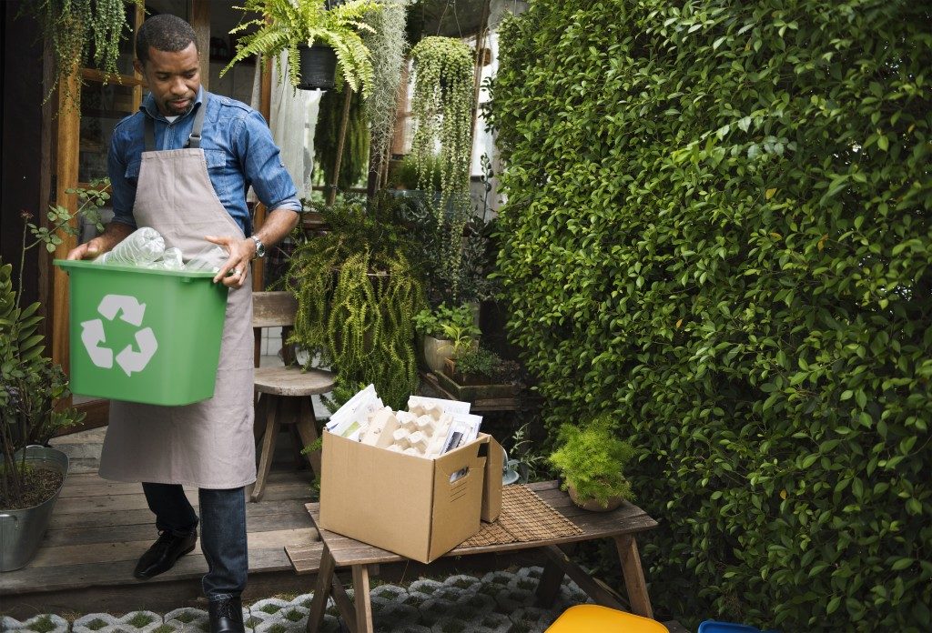 man sorting garbage that can be recycled