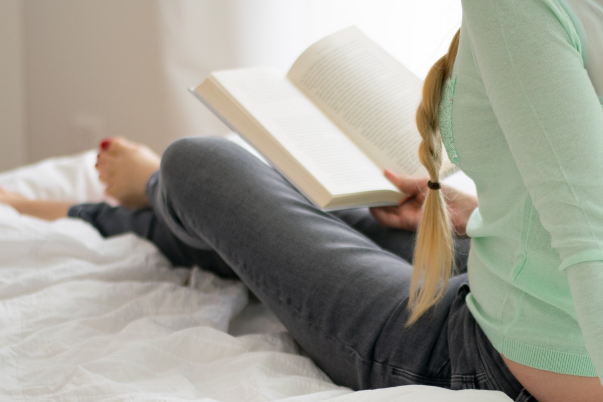 Woman reading on bed