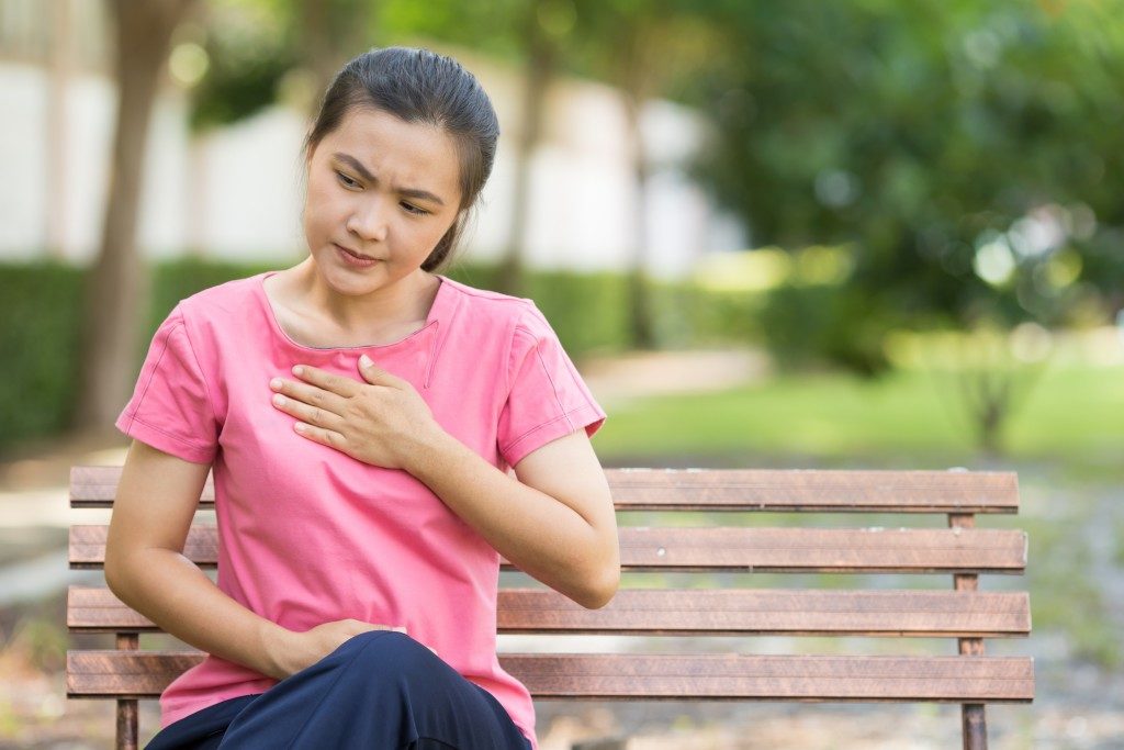 woman feeling hurt in her chest