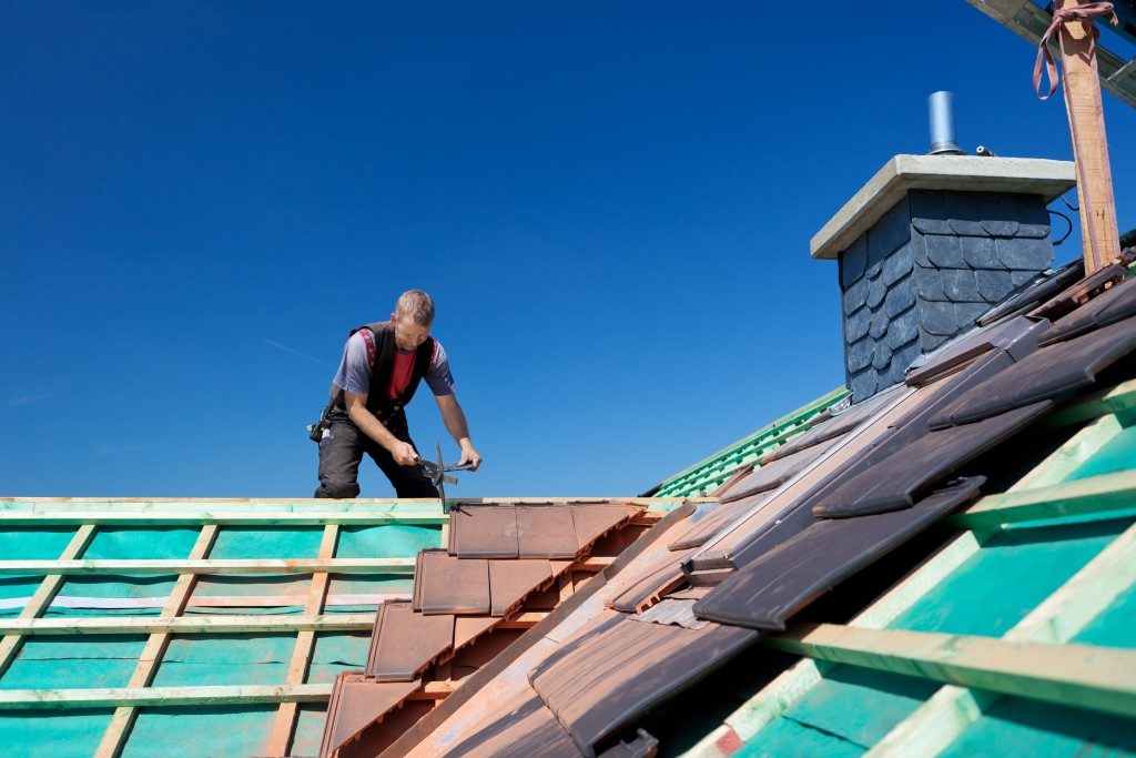 Man fixing the roof