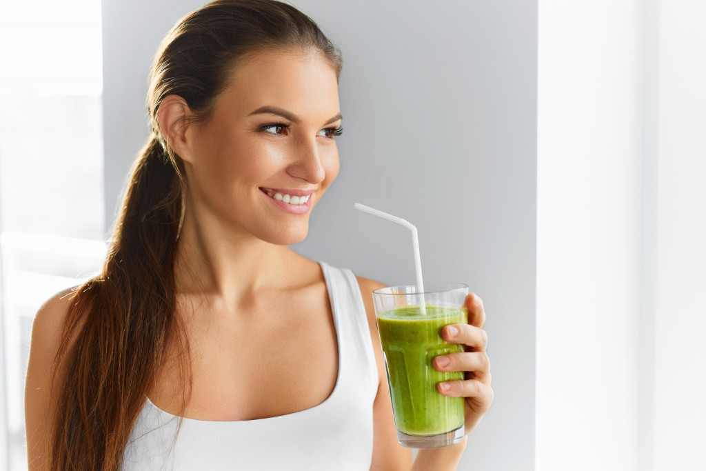 Healthy Eating Woman Drinking Fresh Raw Green Detox Vegetable Juice
