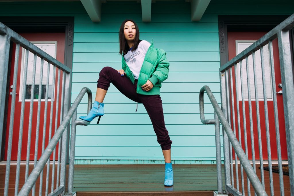 woman posing near a staircase