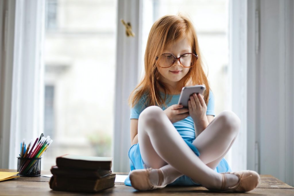 young girl using smartphone