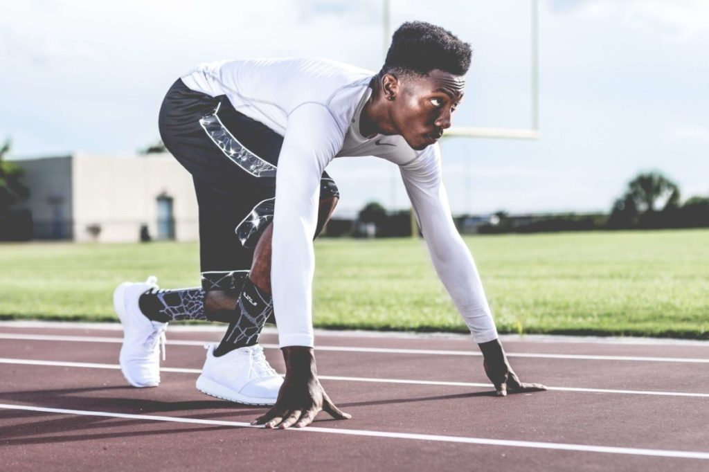 man preparing to run