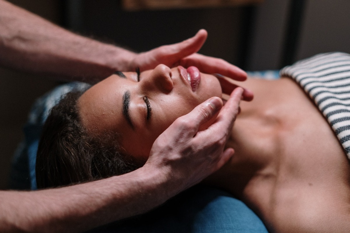 woman having her face massaged