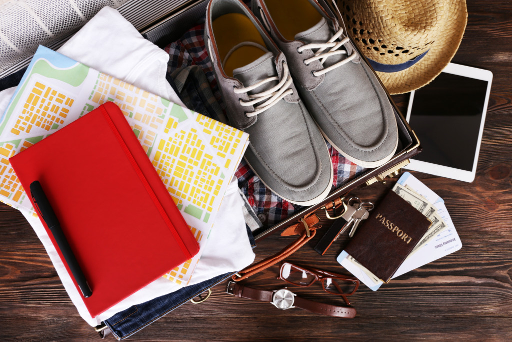 journal, shoes, hat, a cellphone, and passport