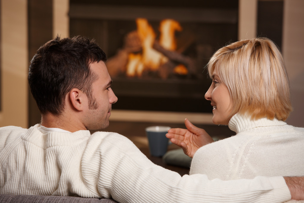 couple by the fireplace
