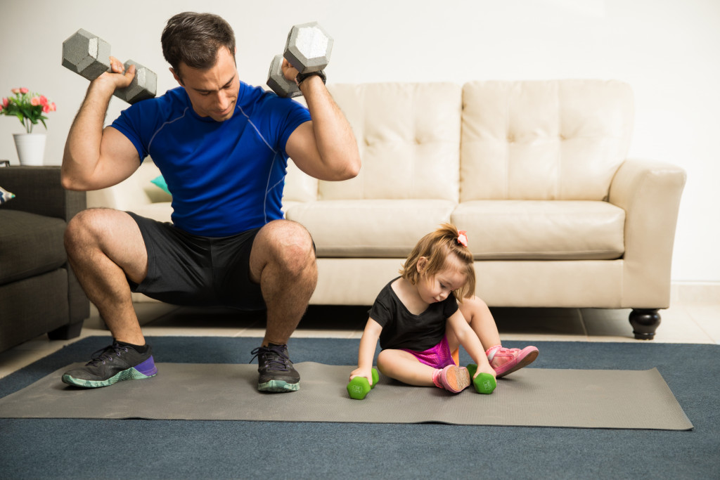 dad working out with his daughter