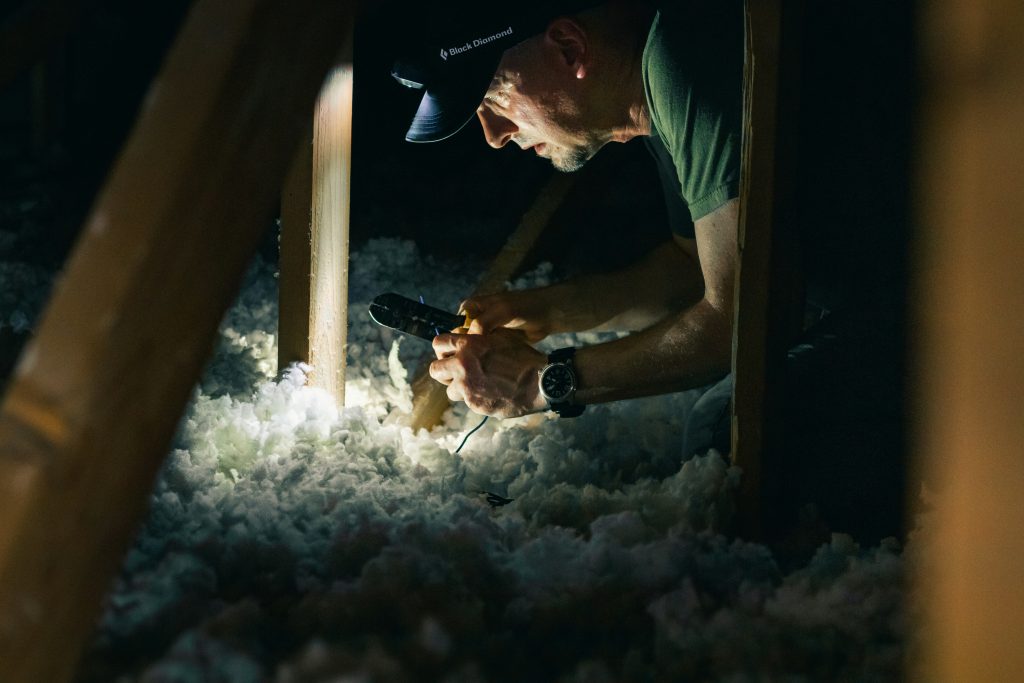 man working in an attic